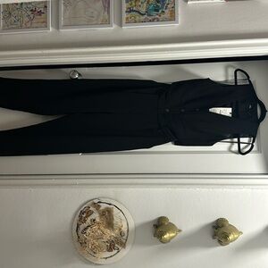 Zara jumpsuit. Black vest open back and sides.